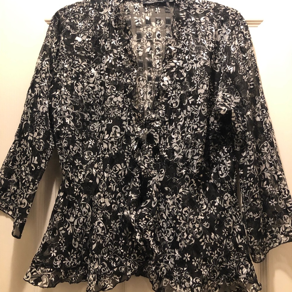 Beautiful Blouse that ties in the middle. Sheer fabric w/ hints of sparkly gold.